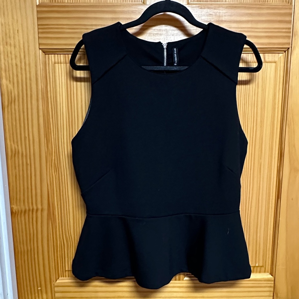 Walter baker sleeveless black peplum top. Size L.